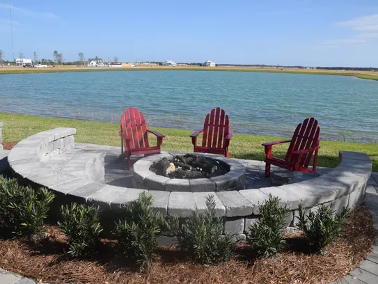 Outside the fire pit area is secluded in a stone semi-circle